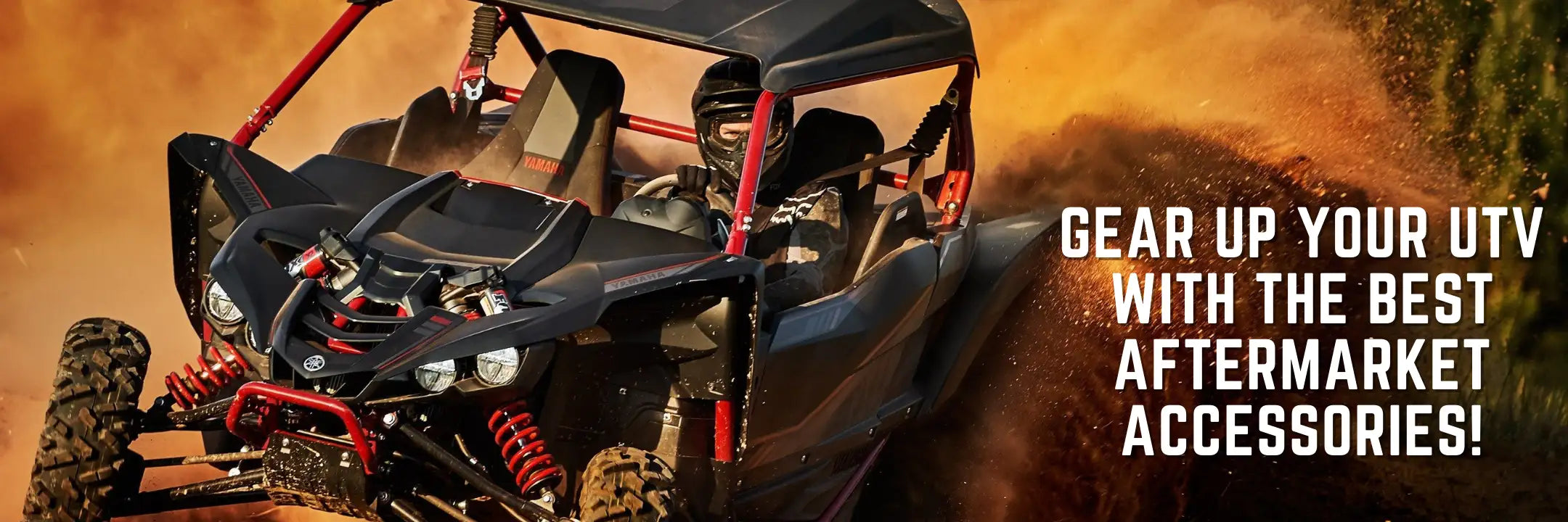 Black and red yamaha yxz1000r utv with rugged off-road tires kicking up dust.
